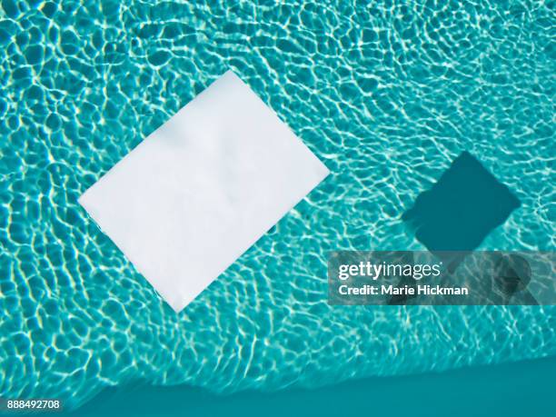 "fill in the blank". white piece of paper floating in a pool. - marie hickman all images stock pictures, royalty-free photos & images