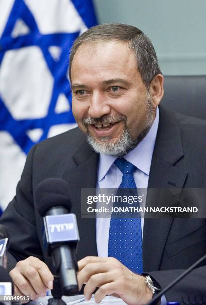 Israeli Foreign Minister Avigdor Lieberman smiles during a meeting of his right-wing Yisrael Beitenu party at the Knesset on July 6, 2009 in...