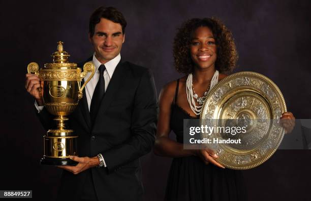 In this handout image provided by the AELTC, Roger Federer of Switzerland, the Mens Singles Champion 2009 and Serena Williams of the United States,...