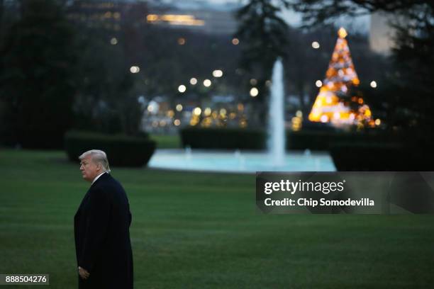 President Donald Trump walks across the South Lawn before departing the White House December 8, 2017 in Washington, DC. Trump is traveling to Florida...