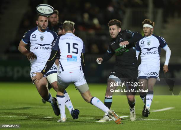 Ali Price of Glasgow Warriors chips the ball during the European Rugby Champions Cup match between Glasgow Warriors and Montpellier at Scotstoun...