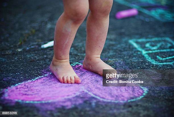 heart in feet - chalk heart stock pictures, royalty-free photos & images