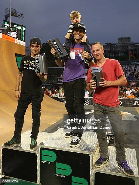 Simon Tabron, 3rd place, Jamie Bestwick, 1st place and Steven McCann, 3rd place, pose after the BMX Vertical Final of the Nike 6.0 BMX Open on June...