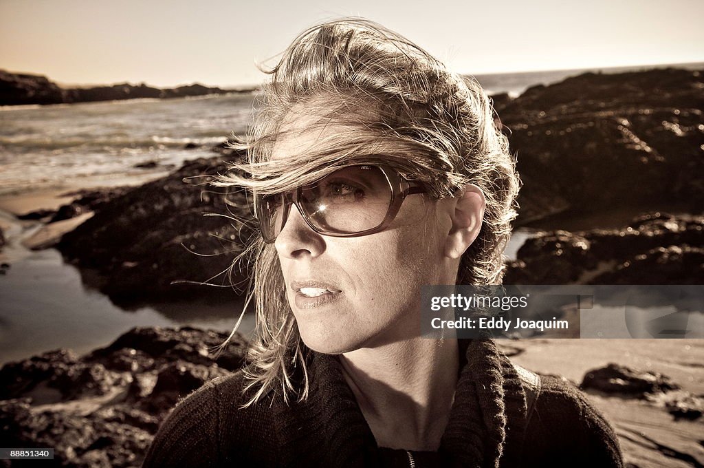 Woman on beach at sunset