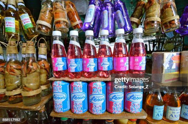 guaraná and infused crab rum in a bottle in maranhão for souvenir - guarana stock pictures, royalty-free photos & images