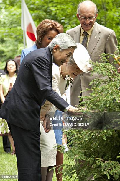Japan's Emperor Akihito and Empress Michiko plant a tree on the grounds of Rideau Hall accompanied by the Right Honourable Micha�lle Jean , Governor...