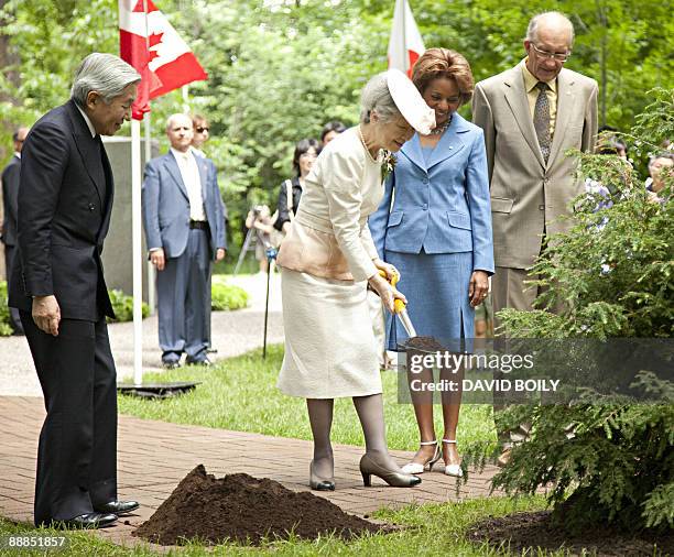 Japan's Emperor Akihito and Empress Michiko plant a tree on the grounds of Rideau Hall accompanied by the Right Honourable Micha�lle Jean , Governor...