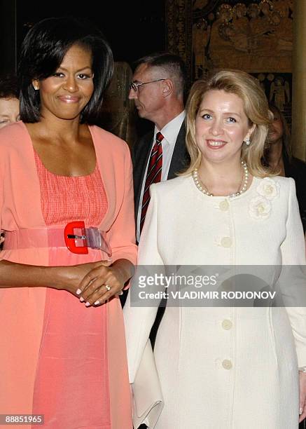 First Lady Michelle Obama and Russian First Lady Svetlana Medvedeva pose for a photograph while looking at Russian Orthodox icons at the Kremlin in...