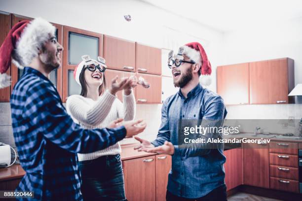 group of people having fun by throwing candy in the air - throwing cake stock pictures, royalty-free photos & images
