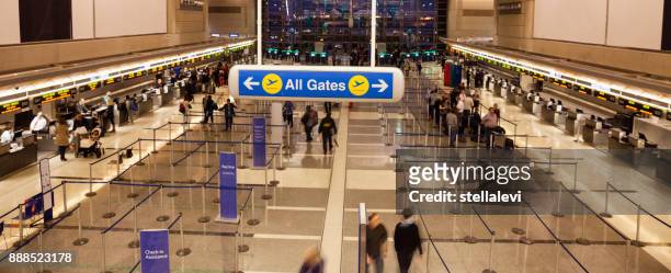 all gates sign at the airport with people checking-in - lax airport stock pictures, royalty-free photos & images