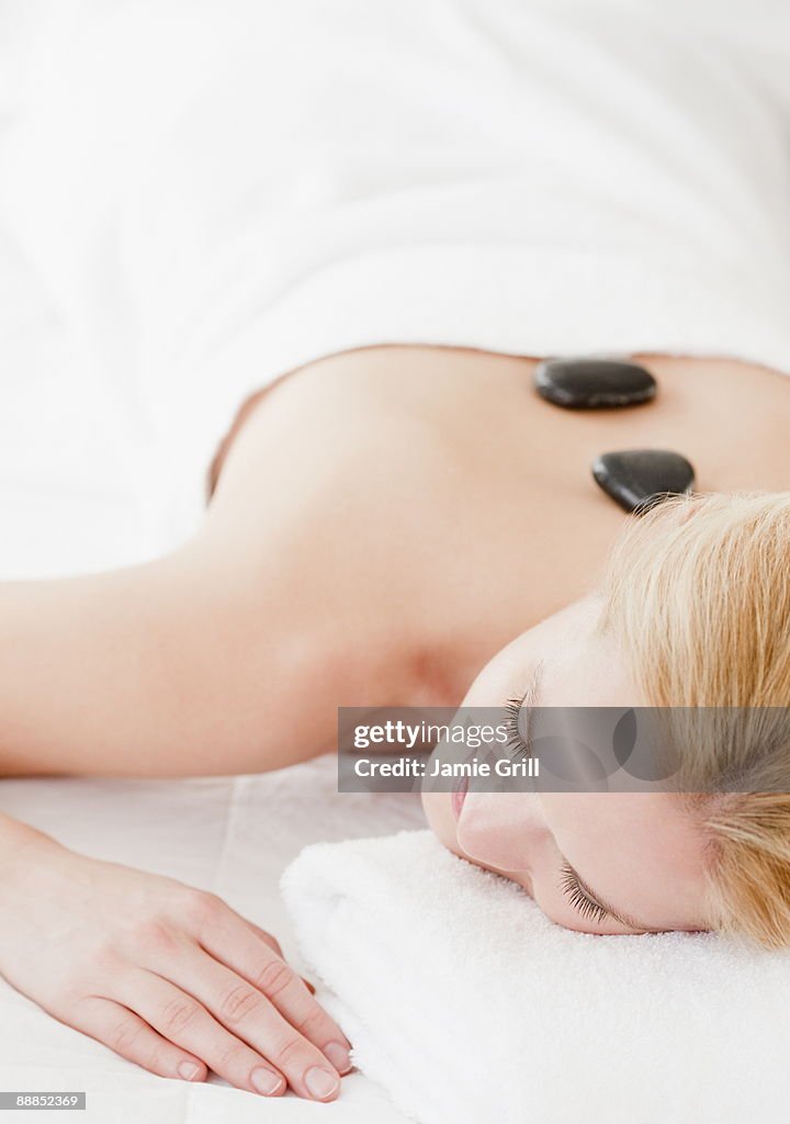 Young woman having lastone therapy