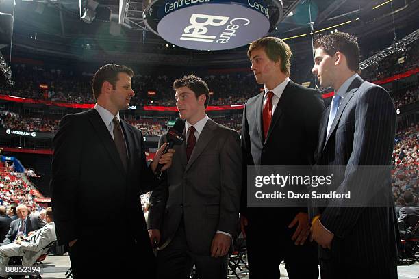 Victor Hedman and John Tavares look on as Matt Duchene speaks just prior to the the first round of the 2009 NHL Entry Draft at the Bell Centre on...