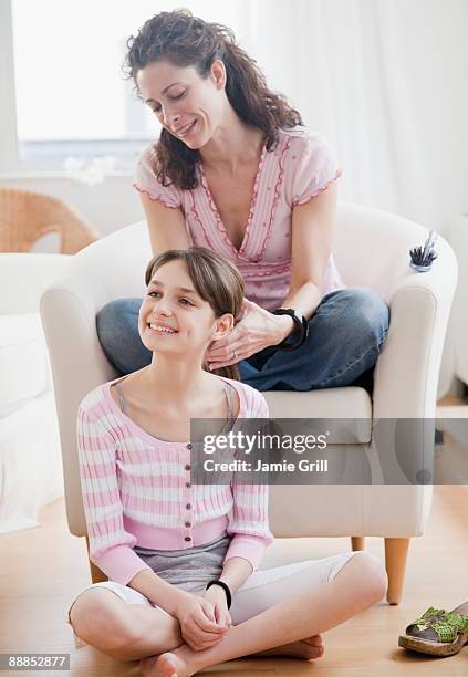 mother styling daughters (10-11 years) hair - 10 to 13 years stock pictures, royalty-free photos & images