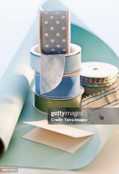 studio shot of decorative ribbons - roll of wrapping paper stock pictures, royalty-free photos & images