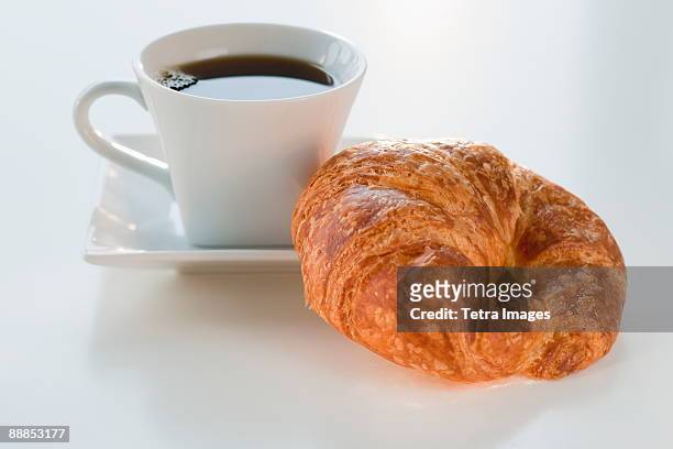 studio shot of coffee and croissant - croissant white background stock-fotos und bilder