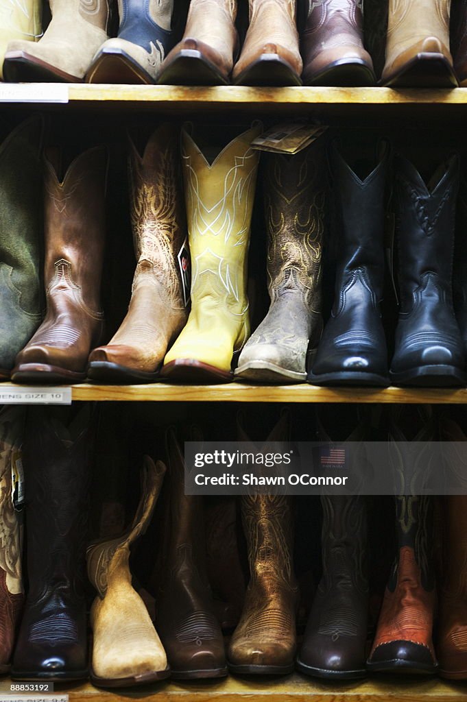 USA, Colorado, Aspen, Boot in row on shelves in shop