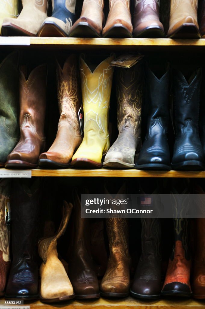 USA, Colorado, Aspen, Boot in row on shelves in shop