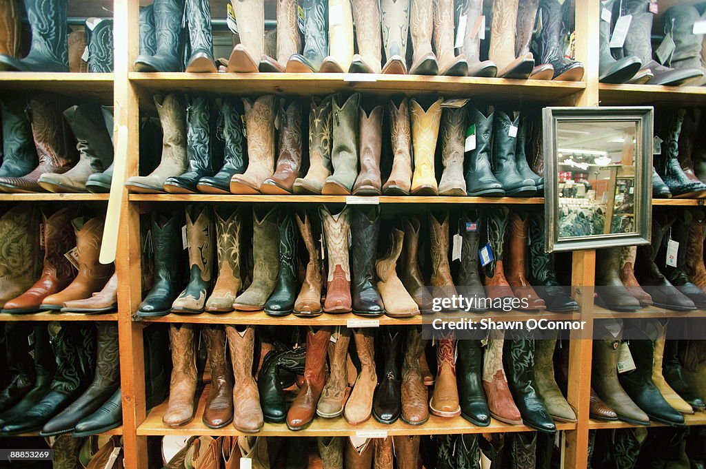 USA, Colorado, Aspen, Boot in row on shelves in shop