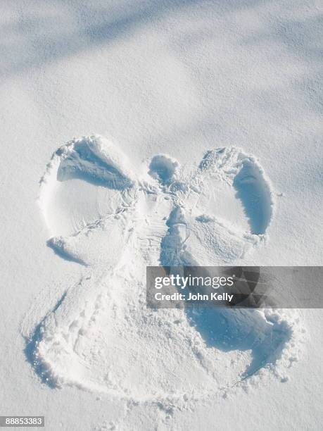 snow angel shape - snow angel stock pictures, royalty-free photos & images
