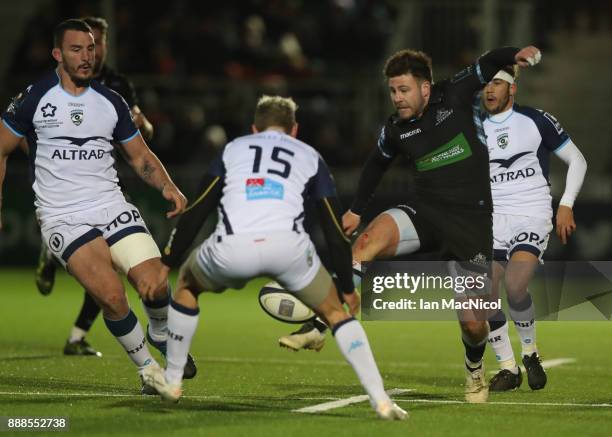 Ali Price of Glasgow Warriors chips the ball during the European Rugby Champions Cup match between Glasgow Warriors and Montpellier at Scotstoun...