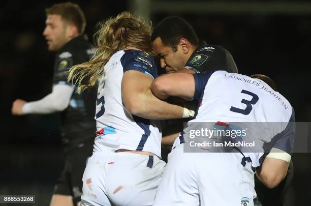 Samula Vunisa of Glasgow Warriors is tackled by Jacques Du Plessis of Montpellier during the European Rugby Champions Cup match between Glasgow...