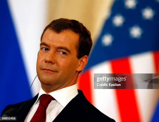 Russian President Dmitry Medvedev listens to translation during a press conference with U.S. President Barack Obama after the signing ceremony of the...
