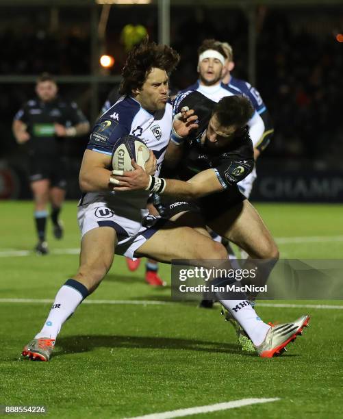 Jan Serfontein of Montpellier evades Tommy Semour of Glasgow Warriors during the European Rugby Champions Cup match between Glasgow Warriors and...