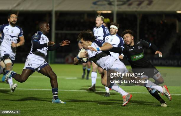 Jan Serfontein of Montpellier evades Ali Price of Glasgow Warriors during the European Rugby Champions Cup match between Glasgow Warriors and...