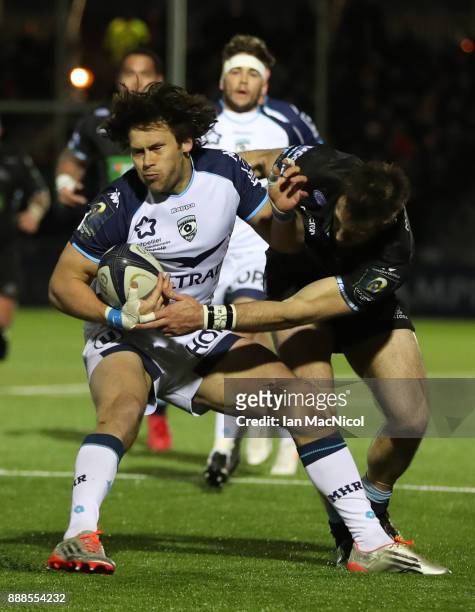 Jan Serfontein of Montpellier evades Tommy Semour of Glasgow Warriors during the European Rugby Champions Cup match between Glasgow Warriors and...