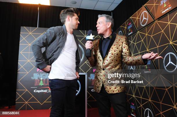 Niall Horan and Elvis Duran attend the Z100's Jingle Ball 2017 backstage on December 8, 2017 in New York City.