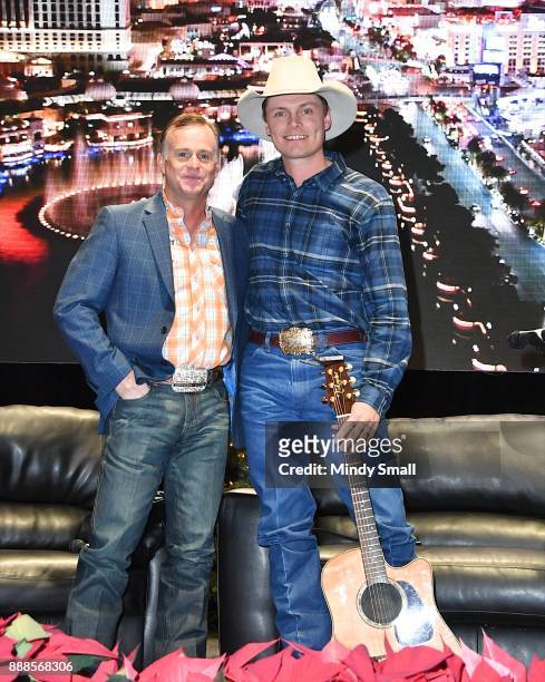Flint Rasmussen poses with recording artist Ned LeDoux during the "Outside the Barrel" with Flint Rasmussen show during the National Finals Rodeo's...