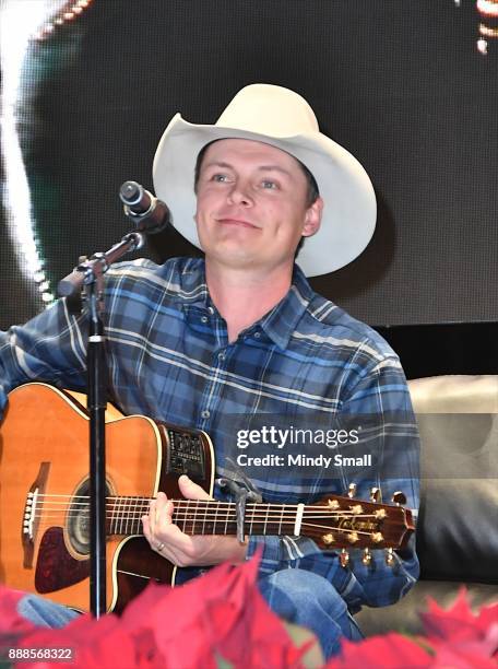 Recording artist Ned LeDoux performs during the "Outside the Barrel" with Flint Rasmussen show during the National Finals Rodeo's Cowboy Christmas at...