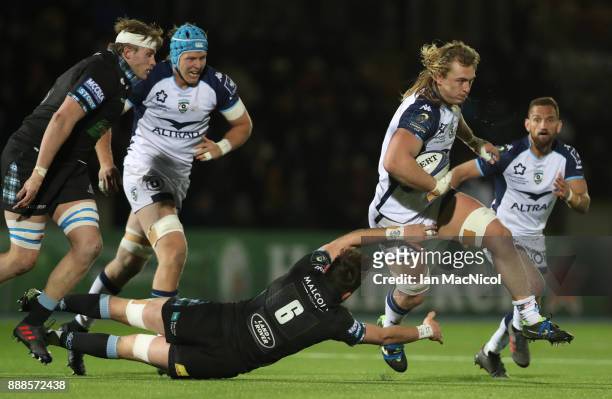 Ryan Wilson of Glasgow Warriors tackles Jacques Du Plessis of Montpellier during the European Rugby Champions Cup match between Glasgow Warriors and...
