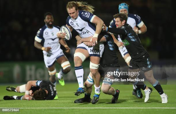 Jonny Gray of Glasgow Warriors tackles Jacques Du Plessis of Montpellier during the European Rugby Champions Cup match between Glasgow Warriors and...