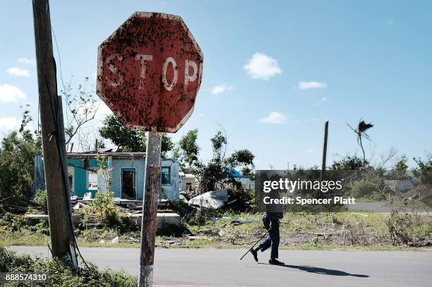 Man walks on the nearly destroyed island of Barbuda on December 8, 2017 in Cordington, Barbuda. Barbuda, which covers only 62 square miles, was...