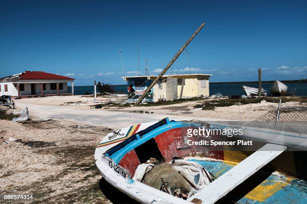 Debris from damaged homes lines a street on the nearly destroyed island of Barbuda on December 8, 2017 in Cordington, Barbuda. Barbuda, which covers...