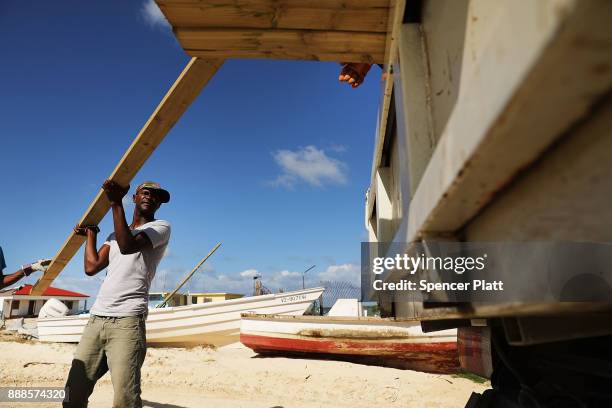 Truck is loaded with plywood on the nearly destroyed island of Barbuda on December 8, 2017 in Cordington, Barbuda. Barbuda, which covers only 62...