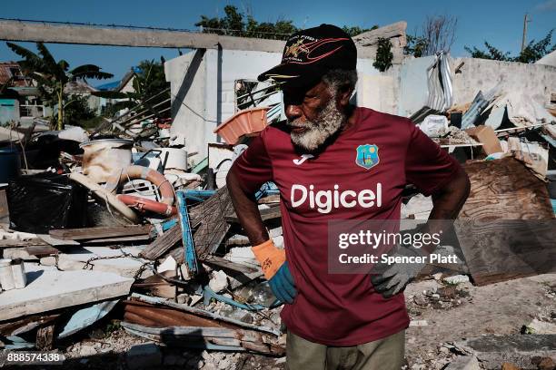 Sherwan Webber stands amongst the debris of his home on the nearly destroyed island of Barbuda on December 8, 2017 in Cordington, Barbuda. Barbuda,...