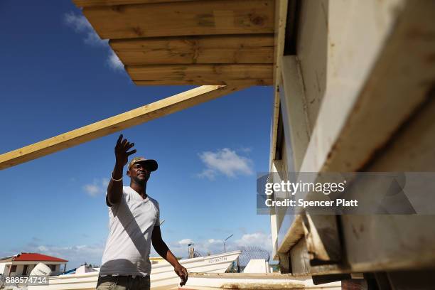 Truck is loaded with plywood on the nearly destroyed island of Barbuda on December 8, 2017 in Cordington, Barbuda. Barbuda, which covers only 62...