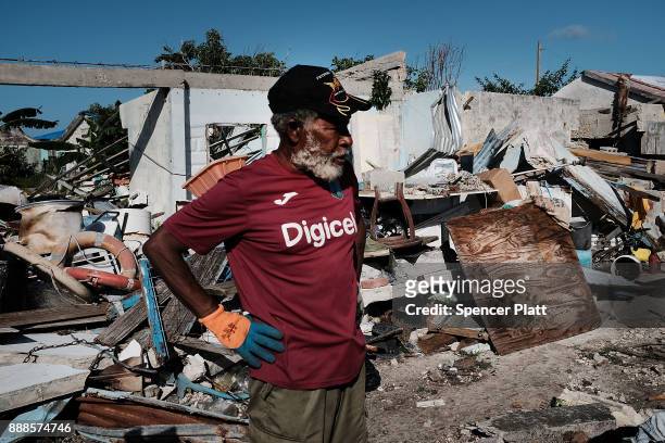 Sherwan Webber stands amongst the debris of his home on the nearly destroyed island of Barbuda on December 8, 2017 in Cordington, Barbuda. Barbuda,...