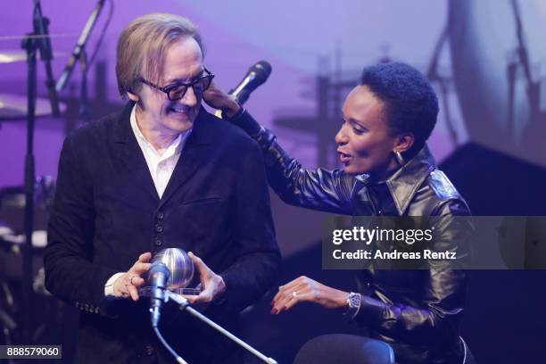 Marius Mueller-Westernhagen receives the award as his wife Lindiwe Suttle congrats during the German Sustainability Award at Maritim Hotel on...