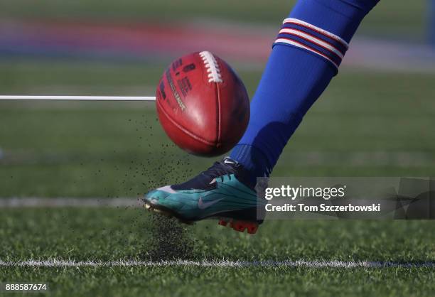 Stephen Hauschka of the Buffalo Bills kicks the ball as he warms up before the start of NFL game action against the New England Patriots at New Era...