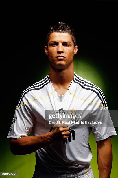 Cristiano Ronaldo poses before his official presentation as a new Real Madrid player at the Santiago Bernabeu Stadium on July 6, 2009 in Madrid,...