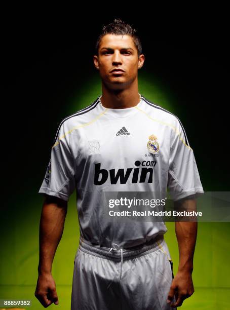 Cristiano Ronaldo poses before his official presentation as a new Real Madrid player at the Santiago Bernabeu Stadium on July 6, 2009 in Madrid,...