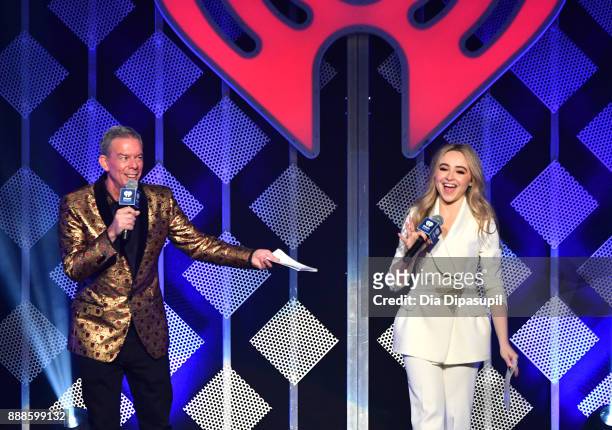 Elvis Duran and Sabrina Carpenter speak onstage at the Z100's Jingle Ball 2017 on December 8, 2017 in New York City.