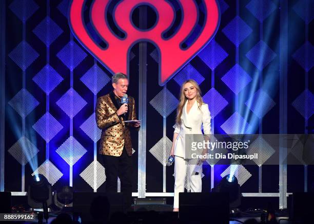 Elvis Duran and Sabrina Carpenter speak onstage at the Z100's Jingle Ball 2017 on December 8, 2017 in New York City.