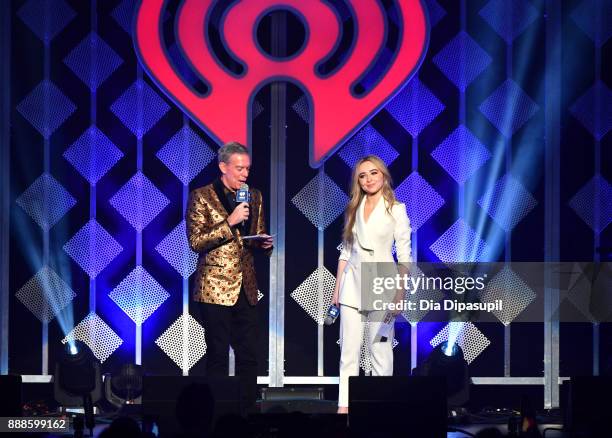 Elvis Duran and Sabrina Carpenter speak onstage at the Z100's Jingle Ball 2017 on December 8, 2017 in New York City.