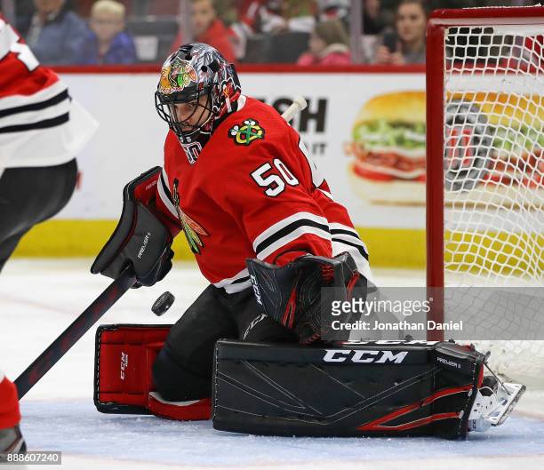 Corey Crawford of the Chicago Blackhawks makes a save against the Buffalo Sabres at the United Center on December 8, 2017 in Chicago, Illinois.