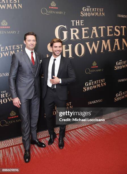 Actors Hugh Jackman and Zac Efron attend the "The Greatest Showman" World Premiere aboard the Queen Mary 2 at the Brooklyn Cruise Terminal on...