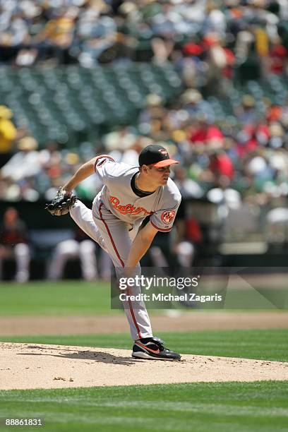 Rich Hill of the Baltimore Orioles pitches during the game against the Oakland Athletics at the Oakland Coliseum on June 7, 2009 in Oakland,...